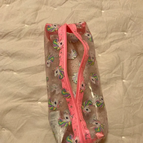 A pink, white, clear unicorn pouch. From: H&M. Name: Unicorn Pouch - Picture 5 of 5